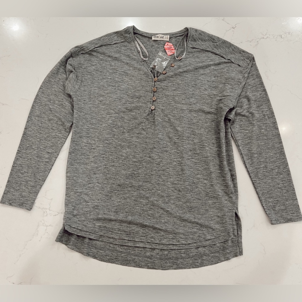 Women’s size small button long sleeve shirt.